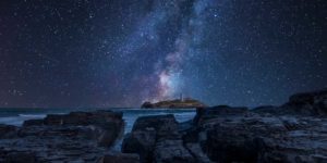 lighthouse under the night sky
